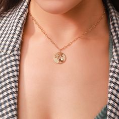 The complement for Lotus is countless, ancient and modern, Chinese and foreign. With this gorgeous engraved Lotus on the coin and a stylish chain, the floral pendant necklace will be a fresh take to your outfit for its unique design dipped in 18k gold. The size of this July birth flower makes it ideal pendent to wear every single day. Upgrade your look and decorate your bare neck. The gorgeous engraved Lotus as July birth flower Ideal size of the necklace Upgrade your look and decorate your bare Elegant Medallion Chain Necklace As Gift, Elegant Medallion Chain Necklace For Gift, Elegant Coin-shaped Chain Necklace With Adjustable Chain, Gold-plated Engraved Coin Necklace, Elegant Gold-tone Coin Necklace, Engraved Gold Plated Coin Necklace, Gold Necklace With Engraved Flower Pendant, Elegant Gold Plated Coin Medallion Necklace, Gold Plated Round Pendant Coin Necklace