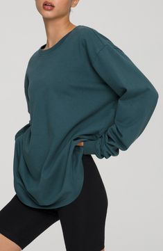 Let yourself lounge in the soft comfort of this oversized long-sleeve T-shirt with slouchy dropped shoulders and cut from breathable cotton. Crewneck Long sleeves 100% cotton Machine wash, tumble dry Imported Women's Clothing Black Owned and Founded Oversized Long Sleeve Athleisure T-shirt, Relaxed Solid Color Tops For Fall, Solid Color Relaxed Tops For Fall, Oversized Sporty T-shirt For Fall, Soft-washed Comfy Long Sleeve Tops, Relaxed Fall Tops, Oversized Crew Top For Fall, Oversized Long Sleeve T-shirt For Fall, Relaxed Crew Neck Top With Cozy Fit