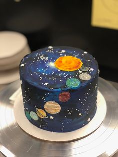 a space themed cake with planets on it