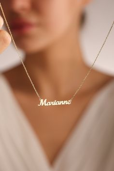 "14k solid gold name necklaces are great personalized gift ideas for special people. You can personalize this gold name necklace and silver name necklace with your own meaningful message. This stunning piece of custom name necklace allows you to customize with different colors. Everyone loves personalized Jewelry and this name jewelry will be your favorite necklace.   💖 Personalized Name Necklaces are one of the most loved designs by our customers. 🎁Great Dainty necklace as mother necklace, Christmas Gift, birthday gift, mothers day gifts, Gifts for mom ✋All our jewelry is %100 custom made by hand with Love and Care in our workshop! Nickel Free High Quality Materials Standard Deliver in 8-12 Business Days Name size - lowercase letters are approximately 4 mm and uppercase letters are appr Gold Necklaces With Name, Elegant Gold Jewelry With Custom Text, Anniversary Yellow Gold Name Necklace, Personalized Letter-shaped Name Jewelry Gift, 14k Gold Nameplate Necklace For Anniversary, 14k Gold Necklaces With Names For Gifts, Gold Necklaces With Custom Text For Gift, Customized 14k Gold Name Necklace For Gift, Custom Text Gold Necklace For Gift