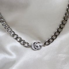 Authentic GG logo choker necklace made with a pendant from a vintage Gucci multiple logo necklace (see last photo for original piece). necklace length: adjustable 14-16 inches pendant measurement: approximately 15mm wide necklace material: stainless steel lobster clasp closure Jewellery Wishlist, Wide Necklace, Jewelry By Brand, Logo Necklace, Statement Choker, Gg Logo, Bag Charms, Toggle Bracelet, Black Choker