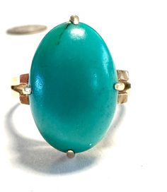 14k ring Gorgeous Turquoise Cabochon in a clean classic Victorian design.  Condition is very good for its age, pictures show the details.  Size 6 3/4, 2/3" north to south on finger, wt.- 5 grams.  Well designed, prong set Turquoise. Vintage Oval Turquoise Ring With Large Stone, Vintage Turquoise Ring With Large Oval Stone, Elegant Oval Cabochon Turquoise Ring For Formal Events, Elegant Oval Cabochon Turquoise Ring For Formal Occasions, Vintage Oval Turquoise Gemstone Ring, Classic Yellow Gold Turquoise Ring, Elegant Oval Cabochon Turquoise Ring For Anniversary, Vintage Oval Turquoise Ring Hallmarked, Antique Turquoise Gemstone Ring For Formal Occasions