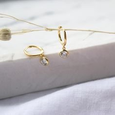 CZ tiny gold hoop earrings, solid gold earrings,  huggie earrings, small hoop earrings with charm, cz drop dangle earrings, wedding earrings A beautiful dainty  CZ hoops earrings simple and cute, perfect for everyday wear.  D E T A I L S: * Hoop: 16mm  * CZ: 7mm M A T E R I A L S: * 100% Sterling Silver 925 or 18K Gold Filled * All sourced from USA -----------------------♡-------------------- H O W T O O R D E R 1.) Choose the Option (Color) in the drop down menu 2.) Choose the quantity in the d Tiny Hoop Huggie Earrings For Anniversary, Tiny Round Huggie Earrings For Anniversary, Huggie Earrings With Lever Back For Wedding, Dainty Yellow Gold Huggie Earrings, Dainty Huggie Earrings For Gift, Dainty Huggie Earrings For Anniversary, Delicate Huggie Hoop Earrings For Gift, Delicate Huggie Hoop Earrings As Gift, Delicate Round Huggie Earrings As Gift