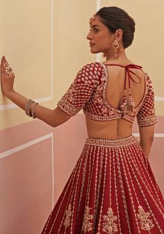 Make a grand entrance on your special day with our Maroon Silk Embroidered Bridal Lehenga. This fashionable raw silk lehenga is meticulously adorned with traditional zardozi embroidery, featuring statement floral motifs crafted with silken threads, dabka, cutdana, and sequins. Complete with a matching modern cut blouse and double dupattas, this bridal lehenga is the epitome of elegance and grace. Perfect for your dream wedding. Composition : Lehenga and Blouse - Raw Silk, Dupatta - Soft Net Care Embroidered Bridal Lehenga, Lehenga And Blouse, Raw Silk Lehenga, Cut Blouse, Zardozi Embroidery, Vacuum Storage, Indian Wedding Wear, Silk Lehenga, Silk Dupatta