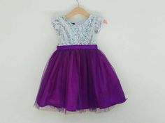 Silver and purple flower girl dress. The top is silver sequin with short sleeve and the bottom is purple glittered tutu with matching satin ribbon belt.Perfect for flower girl dresses in purple wedding theme.The tutu used here is purple number 45I also can do another color as in the last picture, just leave me a note at the 'message to seller' box when check out or do not hesitate to contact me to inquiry.Custom Order Size: Please provide your child measurement: Chest and specific length otherwi Purple Tulle Skirt, Purple Tutu Dress, Purple Flower Girls, Purple Flower Girl Dress, Purple Girls Dress, Flower Girls Dress, Purple Tutu, Purple Wedding Theme, Wedding Purple