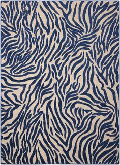 a blue and white rug with zebra print