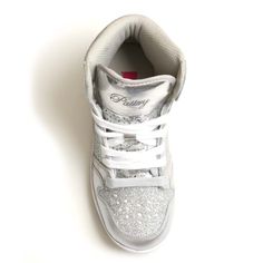 Sparkle with Glam Pie Glitter high top sneakers. Shimmering panels brighten up your athletic style in gold, silver, red, navy or black. This showstopping sneaker provides effortless style on or off the stage. 2 sets of laces Marshmallow Memory foam footbed Perforated leather upper for breathability Padded collar for ankle support Non marking soles 6 color combinations for pairing with any costume or uniform SKU: PK143302 FIT GUIDE: This shoe runs true to size. Luxury Lace-up Sneakers With Glitter Accents, Metallic Glitter Lace-up Sneakers, Silver Sparkling Lace-up Sneakers, Metallic Silver Lace-up Sneakers For Sports, Silver High-top Sneakers With Glitter Accents, Glitter Sneakers, Athletic Style, Ankle Support, Perforated Leather