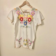 Gorgeous Unused Vintage Top. Imvintage From The 70s. Off White. Colorful Embroidery. 19" Pit To Pit So I'm Guessing A Medium. Cutouts On Hem. Mexican Made. Cotton Polyester Blend. Great For Summer And Vacation. Peasant Shirt, Ice Cream Print, Colorful Embroidery, Printed Sleeveless Blouse, Work Tops, The 70s, Knitted Tank Top, Plus Size Blouses, Embroidered Top