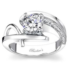 a white gold engagement ring with diamonds on it