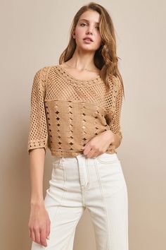 This Short Sleeve Cropped Knit Top is the perfect addition to your wardrobe for nights out and concerts. The western style adds a unique touch, while the oversized and cropped fit allows for versatility in dressing it up or down. Stay on-trend and comfortable with this must-have top. Fall Cropped Open Knit Sweater, Chic Cropped Beige Sweater, Chic Beige Cropped Sweater, Chic Textured Knit Long Sleeve Crop Top, Chic Long Sleeve Textured Knit Crop Top, Chic Pointelle Knit Tops For Fall, Chic Long Sleeve Pointelle Knit Crop Top, Casual Textured Knit Cropped Sweater For Spring, Pointelle Knit Cropped Sweater For Fall