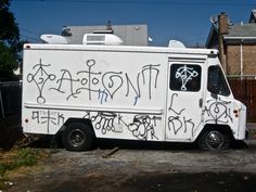 a white truck with graffiti written on it