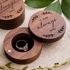 two wooden boxes with wedding rings in them