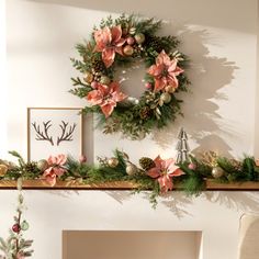 a fireplace mantel decorated for christmas with wreaths and other holiday decorations on it