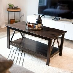 a living room with a coffee table and television