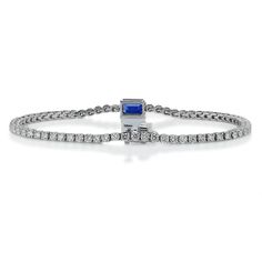 Simple elegance with a modern twist, our Nouveau Tennis Bracelet is strung with a row of twinkling petite diamonds that lead to a captivating emerald cut royal blue sapphire that rest at the center. Everyday luxury is made easy with this captivating bracelet that sparkles from every angle and exudes your strong sense of refined style. Wear it alongside your watch or layer it with a stack of delicate bracelets. Metal: 18kt Gold Sapphire Weight: 1.35 ct. Diamond Weight: 2.95 ct. Measurements: 7.0" Fine Jewelry Sapphire Tennis Bracelet, Luxury Elegant Sapphire Tennis Bracelet, Luxury Sapphire Tennis Bracelet, Classic Sapphire Gemstone Tennis Bracelet, Elegant Sapphire Gemstone Tennis Bracelet, Tennis Bracelet Diamond, Branded Gifts, Everyday Luxuries, Sapphire Jewelry