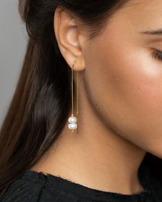 "Pearl Threader earrings, Add a touch of elegance and sophistication to your ensemble with these White Pearl Threaders. These versatile accessories are perfect for any outfit, featuring gold plating and delicately designed Pearl Drop Earrings. Ideal for weddings, these Bridesmaid Jewelry pieces will add a timeless charm to your bridal party. The Dangle Thread Earrings offer a unique and modern twist to traditional pearl jewelry while still maintaining a minimalist aesthetic. Elevate your style with these exquisite and contemporary Bridal Jewelry pieces that will make a statement. DETAILS  These earrings feature two natural pearl options, one in a baroque shape and the other in a flat button shape. They hang from a delicate 24k gold-plated sterling silver threader earring. Modern, elegant, Elegant Gold Plated Linear Earrings For Evening, Gold Linear Earrings With Pearl Chain For Party, Delicate Gold Earrings For Formal Occasions, Elegant Gold Dangle Bridal Earrings, Delicate Bridal Earrings For Formal Occasions, Gold Minimalist Pearl Earrings For Formal Occasions, Delicate Gold-plated Earrings For Formal Occasions, Minimalist Gold Pearl Earrings For Formal Occasions, Delicate Pearl Chain Earrings For Formal Occasions