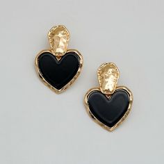 Discover Timeless Elegance Introducing our latest collection piece, the Black Heart Drop Earrings, a perfect blend of vintage charm and contemporary fashion. These earrings feature a classic heart shape, embodying love and elegance in every detail. Crafted from durable zinc alloy, they boast a glossy black finish that adds a touch of sophistication to any outfit. Ideal for women who adore fashion-forward accessories, these earrings are sure to make a statement at any event. Product Features Our Black Heart Drop Earrings are more than just a fashion statement. They are designed with the modern woman in mind, offering both style and comfort. The zinc alloy material ensures durability and long-lasting wear, while the heart-shaped design exudes romance and elegance. With their easy-to-wear dro Chic Metal Heart Earrings For Pierced Ears, Black Double Heart Jewelry For Party, Trendy Black Double Heart Jewelry, Vintage Black Jewelry For Valentine's Day, Black Heart Charm Earrings As Gift, Black Earrings With Heart Charm For Gift, Trendy Black Heart Earrings For Gift, Black Vintage Jewelry For Valentine's Day, Black Heart Drop Earrings For Party