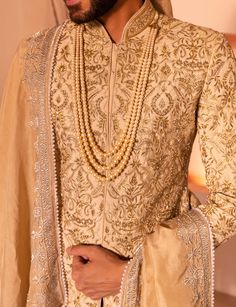 Presenting nawab sherwani in golden color with intricate embroidery scattered all over including beads, thread, sequence, mirror and cutdana work. Festive Bandhgala With Gota Work In Straight Kurta Style, Traditional Drape Churidar With Gota Work For Reception, Traditional Churidar With Gota Work For Reception, Reception Churidar With Gota Work And Traditional Drape, Festive Bandhgala With Gota Work, Transitional Bandhgala With Gota Work And Long Sleeves, Wedding Nehru Jacket With Mirror Work, Transitional Long Sleeve Bandhgala With Gota Work, Festive Designer Bandhgala With Mirror Work