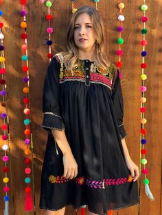 This gorgeous Embroidered dress is traditional yet modern. It is one of a kind! Festive Dresses With Embroidered Sleeves, Festive Dresses With Embroidered Sleeves For Festivals, Folk Style Festive Dress With Multicolor Embroidery, Summer Festive Dress With Embroidered Sleeves, Bohemian Embroidered Dress With Embroidered Sleeves For Festival, Black Bohemian Embroidered Mini Dress, Summer Festive Dress With Geometric Embroidery, Black Bohemian Dress With Intricate Embroidery, Black Embroidered Bohemian Dress