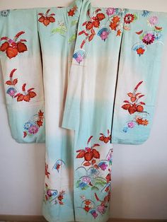 Antique Japanese Silk Kimono  Robe.Uchikake.Silk 100％There are slight stains.  Please check the image.Japanese wedding bride costume, Uchikake.   You can wear it or display it on the wall.The embroidery is gorgeous and wonderful.Size: Body length 170cmWidth 61cmSleeve length 62cmVertical length of sleeves 105cmShipping: Items are shipped via International ems.(Include Tracking)Delivery will take an AVERAGE of 2～3weeks.Caution:Import duties,taxes,and charges are not included in the item price or Vintage Long Kimono For Wedding, Wedding Embroidered Kimono With Kimono Sleeves, Embroidered Wedding Kimono, Vintage Wedding Kimono With Kimono Sleeves, Traditional Embroidered Kimono For Tea Ceremony, Traditional Embroidered Robe With Kimono Sleeves, Traditional Embroidered Summer Kimono, White Long Vintage Kimono, Long White Vintage Kimono