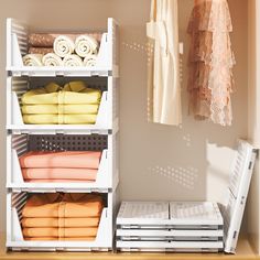 an organized closet with folded towels and other items