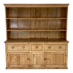 an old wooden hutch with drawers and cupboards