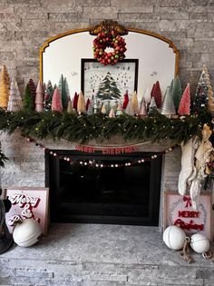 a fireplace decorated for christmas with decorations