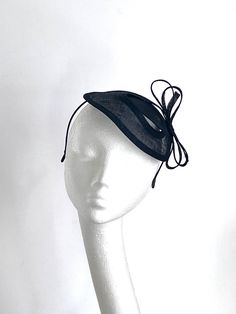 Black fascinator hat This lovely black fascinator Hat is made inspired by coming races. Black fascinator Hat will be an amazing accessory to compliment your outfit. Black fascinator hat will fit an average head size. Its made from fabric covered metal headband attached to the black sinamay saucer base on which sits black bow. Black fascinator hat is very simple and elegant. Its very light on your head. This amazing hat will be a wonderful accessory to compliment your outfit for the Kentucky Derb Black Hat-style Headpieces For Wedding, Black Hat Headpiece For Wedding, Formal Black Costume Hats With Curved Brim, Black Hat Style Headpieces For Wedding, Black Formal Costume Hat With Curved Brim, Black Mini Hat For Wedding At Royal Ascot, Elegant Black Fascinator For Evening, Black Mini Hat For Kentucky Derby Wedding, Black Fitted Fascinator For Evening