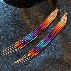 "Maui Swan Designs beautiful, delicate earrings. Czech Glass Seed Beads hand sewn with nylon thread, 4.5\" long. Original design. 20\" total of Rose gold chain fringe. Handmade 14k gold filled clasp. These are stunning & tiny enough u won't feel them on your ears but they are super shiny!!" Sunset Earrings, Fire Earrings, Chain Fringe, Native American Beaded Earrings, Brick Stitch Earrings, Seed Bead Tutorial, Beaded Earrings Patterns, Rose Gold Chain, Earring Patterns