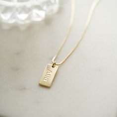 Personalized name & date necklace made just for you! Perfect for remembering key dates like weddings & anniversaries, graduations, and so much more! - - - D E T A I L S- - -• Made of 925 Sterling Silver• Available in 14k Gold, or Rhodium plated (we use a very THICK plating for a piece that will be with you for years to come!)• Nickel-free & Hypoallergenic• DIMENSION: 16mm x 8mm •Comes with a 3" Extension Chain ♡ HOW to ORDER: ♡1. Use the "PERSONALIZATION BOX" to input the DATE/NAME/LETTERS /SYMB Classic Pendant Name Necklace For Anniversary, Classic Personalized Name Necklace For Anniversary, Classic Pendant Charm Necklace For Mother's Day, Elegant Personalized Dog Tag Charm Necklaces, Custom Name Necklace For Anniversary, Minimalist Style, Elegant Personalized Dog Tag Charm Necklace, Classic Personalized Necklaces For Anniversary, Classic Personalized Necklaces For Anniversary Gift, Minimalist Custom Name Necklace For Anniversary