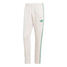 adidas originals Adicolor 70s Monogram Track Pants 'Wonder White Green' IP6984 Adidas Relaxed Fit Sweatpants In Sportswear Style, Adidas Relaxed Fit Sweatpants Sportswear, Three Stripes Relaxed Fit Sportswear Pants, Relaxed Fit Three Stripes Sportswear Pants, Relaxed Fit Sportswear Pants With Three Stripes, Adidas Sportswear Pants For Spring, Adidas Relaxed Fit Sweatpants With Three Stripes, Cotton Relaxed Fit Pants With Adidas Logo, Relaxed Cotton Adidas Pants