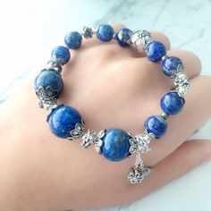 📝Material and Size Lapis Lazuli beads: around 8.5-12.5mm zinc alloy decoration beads, some of the beads are darker for the old vintage style Bracelet length: adjustable around 15cm 💜You will receive the exactly same bracelet as shown in the photo. 💜This handmade Jewelry listing come with an anti-oxidized jewelry box. 💜Please check all measurements and pictures before purchasing. Please keep in mind colors may appear different on screens. 💜All jewelry sold in our store including information Metal Bracelet With Round Beads As Gift, Elegant Metal Beads Bracelet, Adjustable Bohemian Alloy Bracelet, Silver Beaded Bracelets With 108 Round Beads, Metal Beaded Stretch Bracelet As A Gift, Spiritual Bracelets With Round Metal Beads, Metal Stretch Bracelet With Round Beads For Gift, Bohemian Crystal Bracelet With Silver Beads As Gift, Silver Bohemian Stretch Bracelet With 8mm Beads