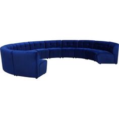 a large blue couch sitting on top of a white floor