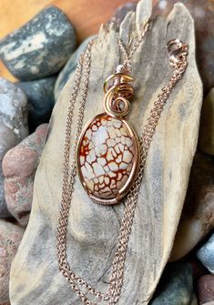 "Dragon vein agate pendant with antique copper, silver, and rose gold wire wrap Comes with 18\" chain shown in photos. Pendant measures 1-5/8\" x 3/4\"" Hand Wrapped Gold Agate Necklaces, Oval Agate Healing Jewelry, Hand Wrapped Gold Agate Necklace, Ocean Jasper Wire Wrapped Pendant Necklaces, Wire Wrapped Ocean Jasper Pendant Necklaces, Wire Wrapped Ocean Jasper Pendant Necklace, Wire Wrapped Round Agate Jewelry, Unique Nickel-free Agate Jewelry, Nickel-free Agate Jewelry For Healing