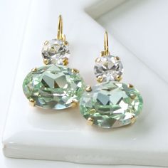 Fresh Light Green Swarovski Crystal Ovals with Clear Crystals on Top, Dangle Lever Back Earrings in Gold, Crystal Drop Earrings in Gold Emerald Bridesmaids, Crystal Ball Earrings, Swarovski Crystal Drop Earrings, Emerald Earrings Drop, Clear Crystal Earrings, Bridesmaid Earrings Gold, Blue Crystal Earrings, Bridesmaid Gifts Jewelry, Green Oval