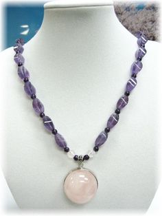 "This is a high grade piece of necklace consisting of 26 pcs of high clarity violet Amethyst which are being spaced in between with round 3mm deep purple Amethyst beads. The high graded Rose Quartz hemisphere shaped pendant is encased in 925 silver rim and bail.  The entire necklace measures 19\" and ends beautifully with a set of 925 silver toggle. This item will come to you in a beautifully packaged box suitable for gift giving. A LITTLE FACT ABOUT AMETHYST: The colours of the amethyst - from Amethyst Crystal Necklaces With Round Pendant, Amethyst Faceted Beads Jewelry, Lavender Round Jewelry With Faceted Beads, Spiritual Faceted Beaded Necklaces, Round Faceted Amethyst Beads Jewelry, Spiritual Amethyst Round Pendant Necklace, Faceted Amethyst Healing Necklace, Round Amethyst Jewelry With Faceted Beads, Spiritual Faceted Amethyst Crystal Necklace