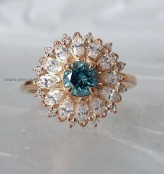 Blue Moissanite Art Deco Ring, Cyan Blue Moissanite Engagement Ring, Wedding Ring, Anniversary Gift Engagement Ring, Wedding Gift Ring → center stone type : Moissanite → center stone shape : Round → center stone color : Blue → center stone size : 5 → center stone clarity : vvs → luster : exellent → make : High Quality → Moissanite MOHs scale : 9.25 → Moissanite refractive index : 2.65 SIDE STONE DETAIL → side stone shape : Marquise & Round ( Lab Diamond ) → side stone color : G (white) → sid Blue Moissanite Engagement Ring, Blue Moissanite, Blue Diamond Ring, Oval Diamond Ring, Mohs Scale, Cyan Blue, Gold Bracelets, Rose Engagement Ring, Deco Ring