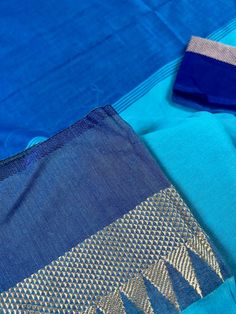 Beautiful Handloom Saree different shades of Ocean Colors (Blue) with Temple Borders with Muted Zari Weave. Saree in Pure Khaadi Handloom Cotton. Item : SareeColor : BlueBase Fabric : Pure Khaadi Handloom Cotton. Blouse piece : Comes with un-stitched Blouse piece.Blouse material : Pure Khaadi Handloom Cotton. Work : Handloom SareeFall & Edging : Comes with Fall and edging (Pico) done and Tassels attached Disclaimer -:- Color variation is possible due to various reasons like phone or desktop sett Blue Slub Silk Anarkali Set, Festive Blue Slub Silk Salwar Kameez, Blue Slub Silk Saree Set, Blue Bollywood Style Salwar Kameez In Slub Silk, Blue Cotton Silk Churidar With Zari Work, Blue Cotton Silk Kurta For Navratri, Blue Festive Slub Silk Traditional Wear, Blue Cotton Silk Churidar For Navratri, Blue Cutdana Kurta For Navratri