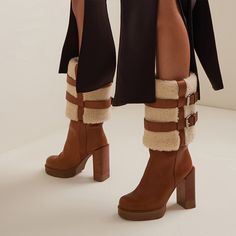 These mid-calf booties feature a comfortable round toe design, lambswool lining for extra comfort, and a chunky heel for stability and a touch of elegance. The rich brown suede exterior exudes a timeless appeal, effortlessly complementing any outfit. Its platform design not only enhances your stature but also provides added comfort for all-day wear. Perfect for cold-weather fashion or a stylish statement piece, these boots are sure to become a beloved staple in your footwear collection. Style: m Winter Brown Mid-calf Boots With Reinforced Heel, Winter Knee-high Platform Boots With Lug Sole, Brown Mid-calf Boots For Winter, Brown High Ankle Mid-calf Boots For Winter, Winter Brown Moto Boots With Reinforced Heel, Brown Winter Moto Boots With Reinforced Heel, Winter Moto Boots With Reinforced Heel In Brown, Brown Knee-high Boots For Winter, Winter Mid-calf Platform Boots Medium Width