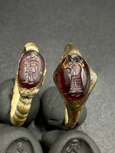 The Lot of Total 2 Beautiful Bronze Ring With Unique Intaglio Seal Stamp Engraved (Carved)On Garnet Stone A Human Figure Probably From Ancient Achaemenid Empire Civilizations. Originated From Central Asia. The Ring Intaglio Is Imprinted On Wet Clay For Better View In The Pictures . Rare Ancient Bronze Jewelry Ring . Best Item For Collections and Study . Fast and Free Shipping World Wide. Ancient Oval Engraved Jewelry, Ancient Ceremonial Hallmarked Jewelry, Ancient Intaglio Ring Jewelry, Ancient Ceremonial Jewelry, Ancient Style Carved Rings Gift, Ancient Style Engraved Ceremonial Jewelry, Antique Carved Engraved Ring For Ceremonial Use, Traditional Ceremonial Intaglio Jewelry, Traditional Intaglio Jewelry For Anniversary