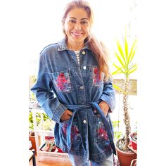 Hand painted denim jacket with abstract motifs in red and blue colors. Called "Coral Garden", this garment is unique and exclusive, of our own design, hand painted with special waterproof and wear-resistant acrylics. With rhinestone applications in red colors with silver and gold edges, and blue rhinestones. Standard size equivalent to a female M. Measurements: chest circumference 104 cm; total length 77 cm. Blue denim that falls below the hips. Jacket with buttons and belt loop, blue denim color. Delicate garment, hand wash. The garment was sent to be made by a workshop located in Santiago, Chile. Artistic Denim Outerwear For Spring, Blue Floral Denim Outerwear, Casual Hand Painted Blue Outerwear, Artistic Blue Denim Jacket For Spring, Hand Painted Blue Outerwear For Spring, Hand Painted Blue Cotton Outerwear, Blue Hand Painted Outerwear For Spring, Hand Painted Blue Spring Outerwear, Blue Hand Painted Spring Outerwear