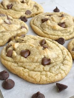 chocolate chip cookies on a baking sheet ready to be eaten