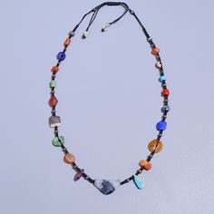 A beautiful hand crafted necklace made with ancient Lapis, turquoise, etched carnelian, sulemani agate, coral. the coral is from yemen circa 1400AD all other beads are Afghan origin circa 100AD-200BC. the necklace is made with very fine thread which feels comfy around the neck & gives a very pleasant vibe. All the beads are 100% real antiques found in excavations at different sites. they are not manufactured now or modified but were created by ancient humans by hand. literally one of a kind necklace!! Adjustable Turquoise Necklace With Natural Stones For Meditation, Adjustable Beaded Necklaces For Rituals, Agate Amulet For Healing, Artisan Multicolor Crystal Gemstone Necklace, Adjustable Multicolor Amulet Jewelry, Lapis Lazuli Crystal Necklaces For Jewelry Making, Lapis Lazuli Crystal Necklace For Jewelry Making, Blue Agate Jewelry With Colorful Beads, Bohemian Lapis Lazuli Beaded Necklaces As Gift