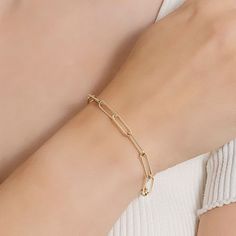 Add a trendy look to your jewelry collection by adding this Silver Reflections 14K gold over brass paperclip chain bracelet. This bracelet is crafted in 14K gold over brass, available in 7.25 inches length, has a solid paperclip chain construction and features a lobster clasp closure for a safe and comfortable wear. If you're looking for the perfect trendy chain bracelet for stacking or to wear alone, this bracelet is just what your jewelry collection needs! Wipe bracelet clean with a soft cloth Gold-tone Paperclip Bracelet With Rectangular Links, Elegant Gold Plated Paperclip Chain Bracelet, Gold Link Paperclip Bracelet, Tarnish Resistant, Gold-tone Bracelet With Paperclip Chain, Gold-tone Link Paperclip Bracelet In Minimalist Style, Gold-tone Link Paperclip Bracelet Minimalist Style, Tarnish Resistant Gold Link Paperclip Bracelet, Modern Gold Plated Paperclip Chain Bracelet, Tarnish Resistant Gold Paperclip Link Bracelet