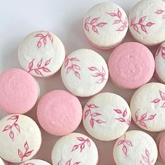 pink and white cupcakes with leaves on them