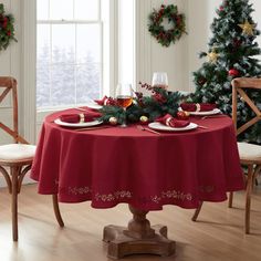 a dining room table set for christmas dinner