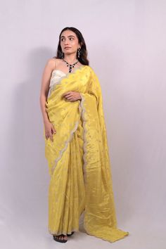 100% Pure Viscose Gold Tissue Saree For Women | Wedding Wear A tissue saree is a type of saree made from tissue fabric, which is a lightweight, sheer fabric with a subtle shimmer. Tissue fabric is often made from silk or synthetic fibers and is known for its delicate texture and elegant drape. Tissue sarees are popular choices for special occasions such as weddings, parties, and festivals due to their luxurious appearance and graceful flow. These sarees may be adorned with embellishments such as Gold Tussar Silk Saree For Reception, Reception Saree In Tissue Silk With Cutdana, Reception Tissue Silk Saree With Cutdana, Cotton Silk Pre-draped Saree For Wedding And Eid, Cotton Silk Blouse Piece For Wedding And Eid, Wedding Pre-draped Cotton Silk Saree With Resham Embroidery, Silk Saree With Cutdana For Reception, Tussar Silk Pre-draped Saree For Reception, Tussar Silk Blouse Piece With Sheer Dupatta For Reception