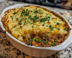 a casserole dish with meat and vegetables in it