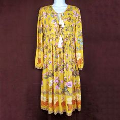 R. Vivimos Tassel Floral Boho Midi Dress In Mustard Yellow, Cream, And Pink. Long Sleeves. Gathered Sleeves. No Stains Or Holes. Flowy Boho Bohemian Dress. Farmcore Dress. No Material Tag. Size: M / 8 / 10 Length: 45" Pit To Pit: 18" Sleeve: 24" Waist: 17" Condition: New With Tag Box N D Yellow Floral Print Maxi Dress For Festival, Yellow Floral Print Dress For Festival, Yellow Bohemian Dress With Tassels, Yellow Long Sleeve Bohemian Dress, Mustard Bohemian Maxi Dress, Yellow Bohemian Maxi Dress For Fall, Yellow Tassel Beach Dress, Mustard Bohemian Flowy Dress, Yellow Bohemian Dress For Fall