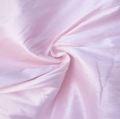 a close up view of a pink fabric